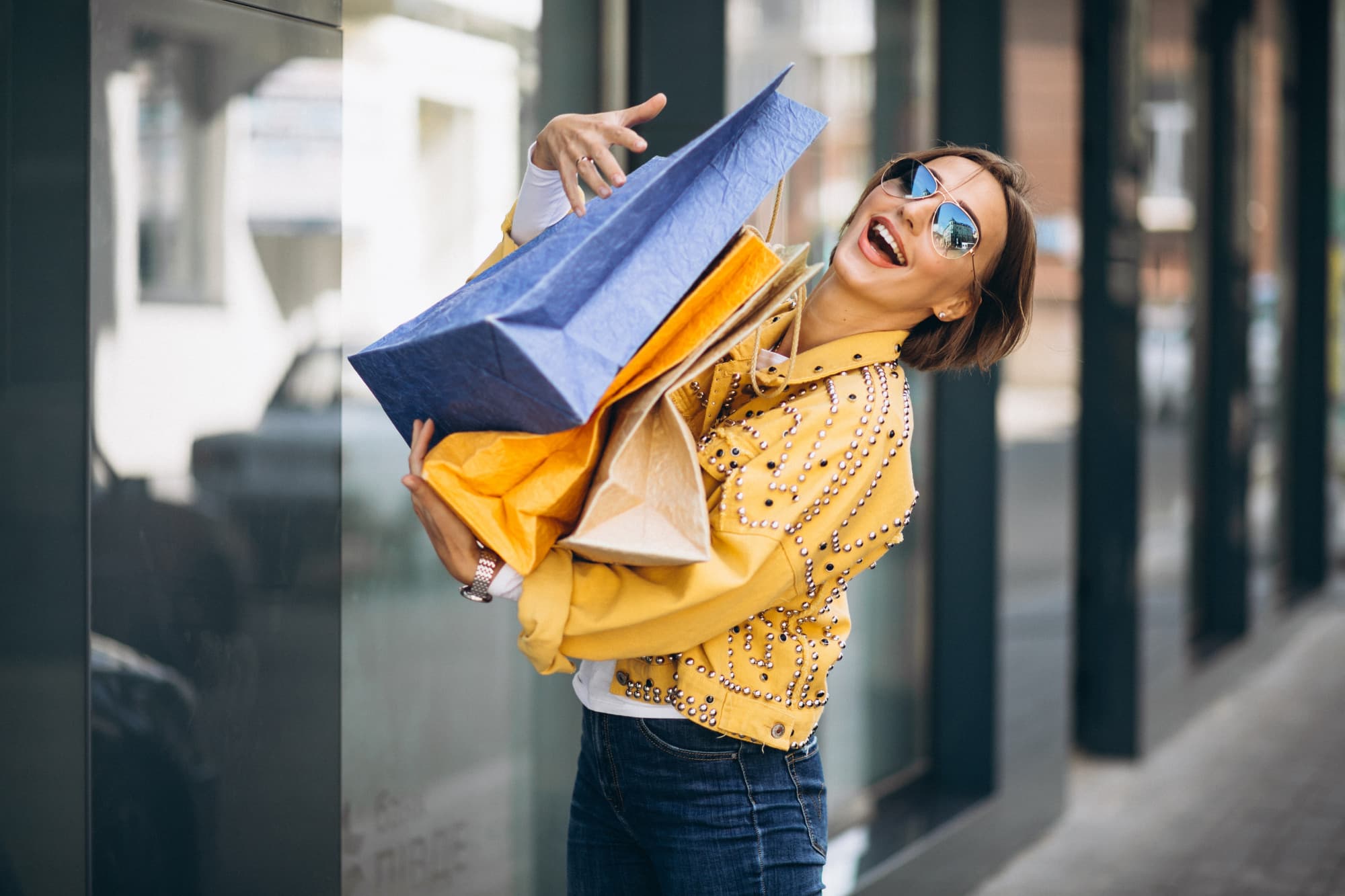 Member carrying shopping bags